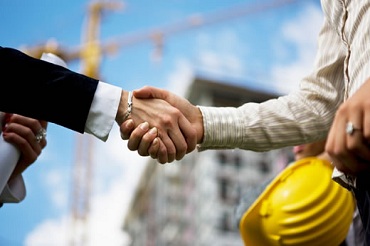 Handshake on a building site